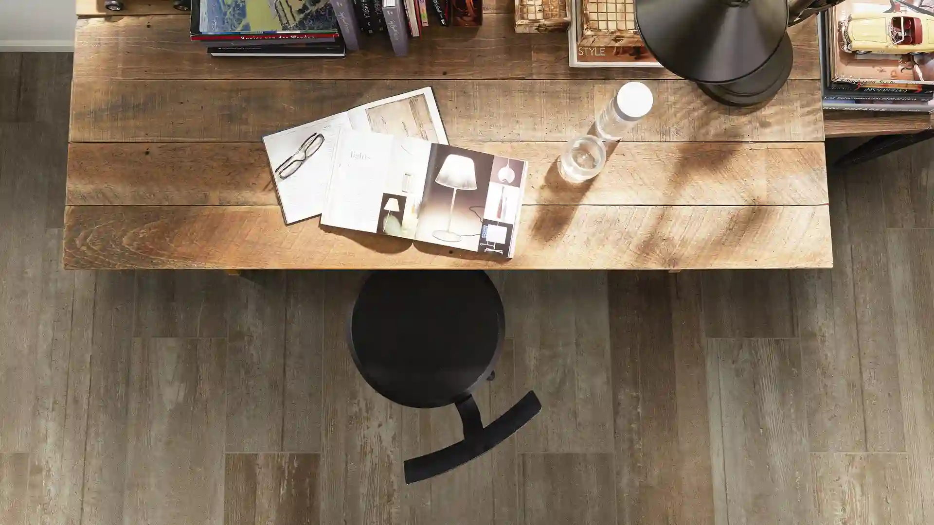 wide plank flooring in office with rustic desk 